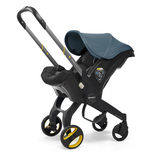 Ocean Blue doona stroller with a blue canopy on a white background