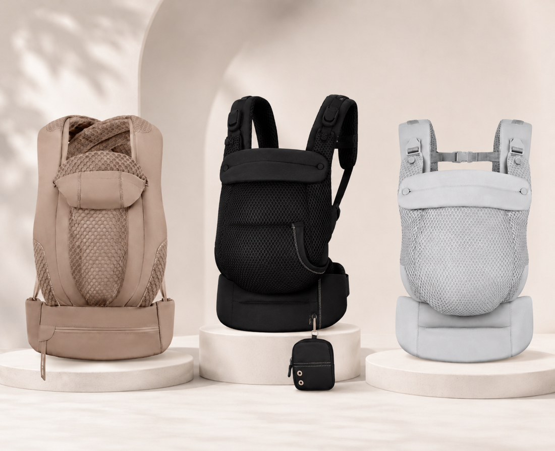 Three baby carriers in beige, black, and light gray are displayed side-by-side on individual white pedestals.