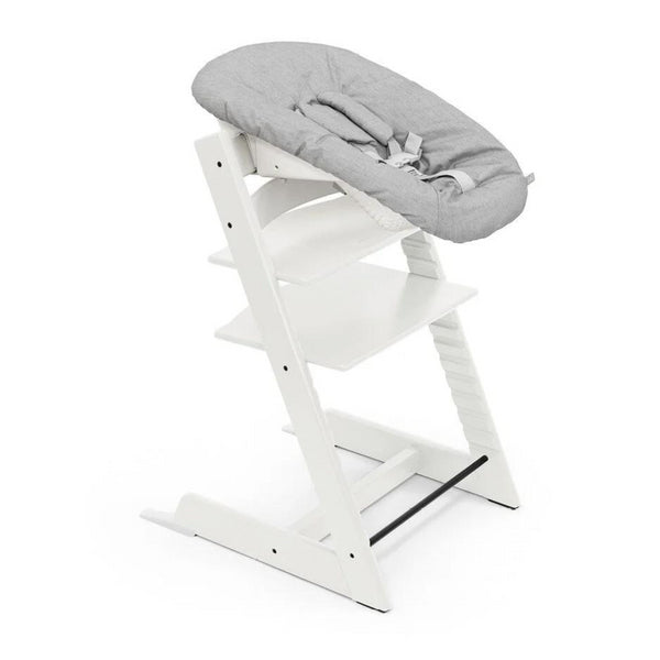 
White high chair with a gray cushion on a white background