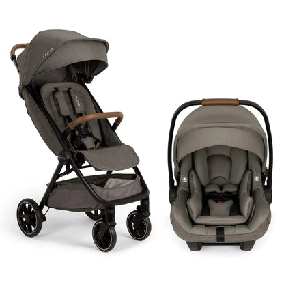 
Gray Nuna stroller with leatherette accents alongside a matching infant car seat on a white background.