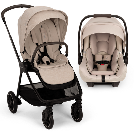 [Biscotti/Biscotti] A stroller and infant car seat travel system in a light beige/tan fabric with black frames, shown on a clean white background. The stroller is positioned on the left, and the matching car seat is positioned on the right.