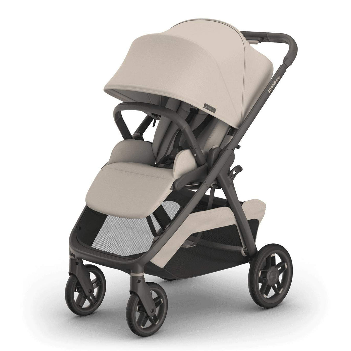 
A beige baby stroller with a grey frame, canopy, and lower storage basket, isolated on a white background.
