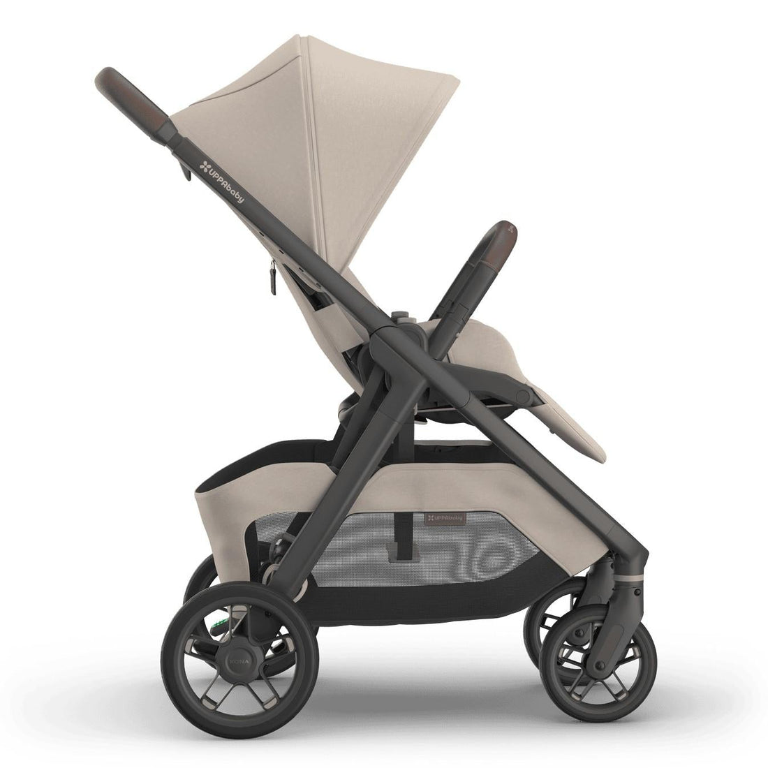 
Side profile of a beige forward-facing baby stroller with a grey frame and sun canopy, isolated on a white background.