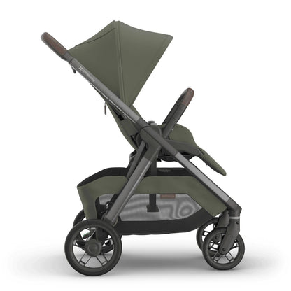 
Side profile of an olive green forward-facing baby stroller with an extended sun canopy and grey frame, isolated on a white background.
