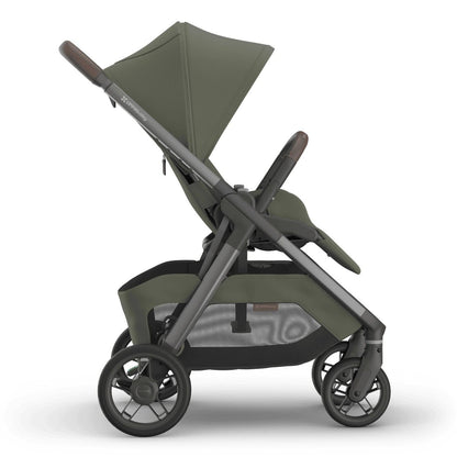 
Side profile of an olive green forward-facing baby stroller with a grey frame, isolated on a white background.