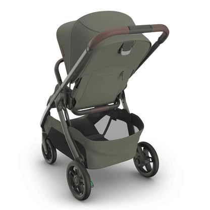 
Three-quarter rear view of an olive green baby stroller with a grey frame, canopy, and storage basket, isolated on a white background.