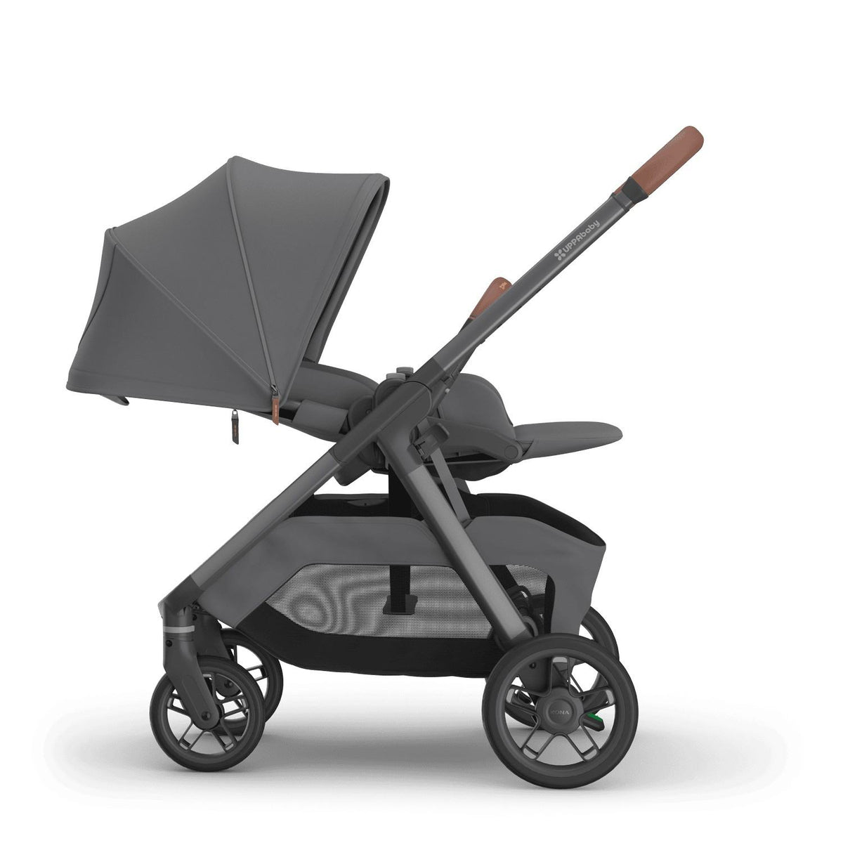 
Side profile of a reclined grey parent-facing baby stroller with an extended sun canopy and brown leather handle grips, isolated on a white background.