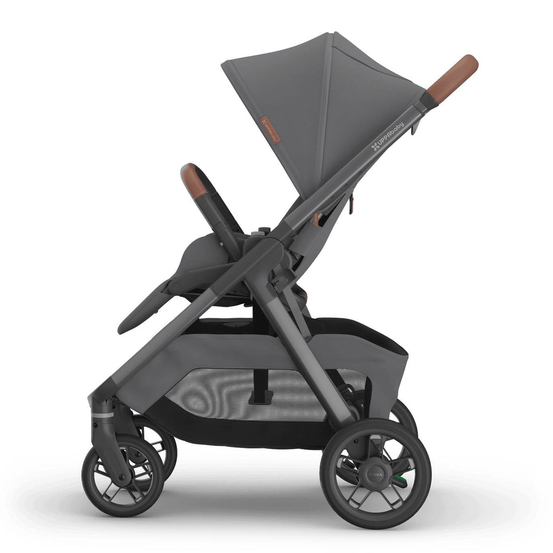 
Side profile of an upright grey parent-facing baby stroller with brown leather handle grips, isolated on a white background.