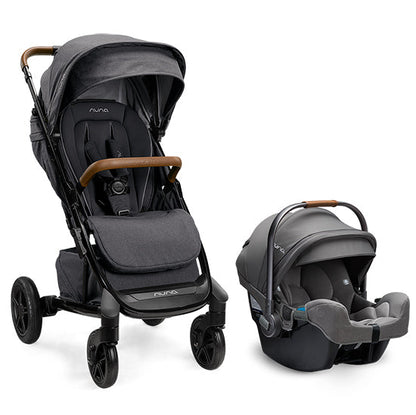 
A Nuna stroller and infant car seat travel system in dark gray and black, featuring brown wooden handle accents, shown on a clean white background.