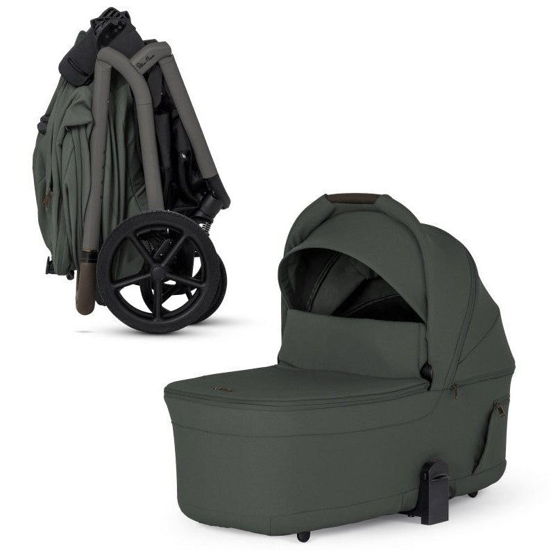 An olive green stroller shown compactly folded alongside its matching standalone olive green bassinet.