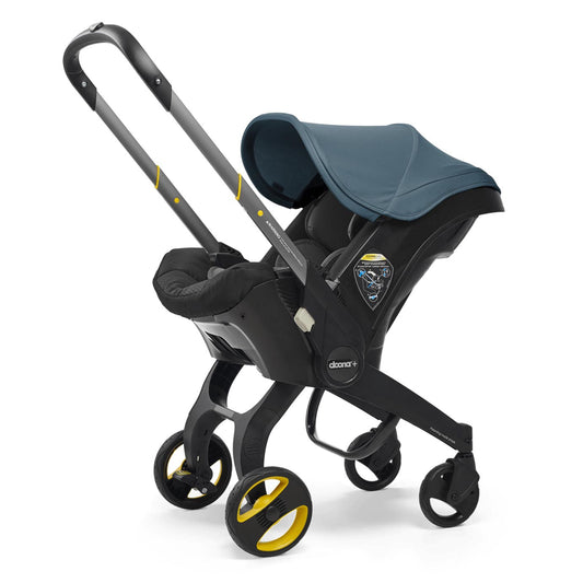 Ocean Blue doona stroller with a blue canopy on a white background