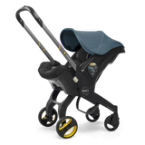 Ocean Blue doona stroller with a blue canopy on a white background