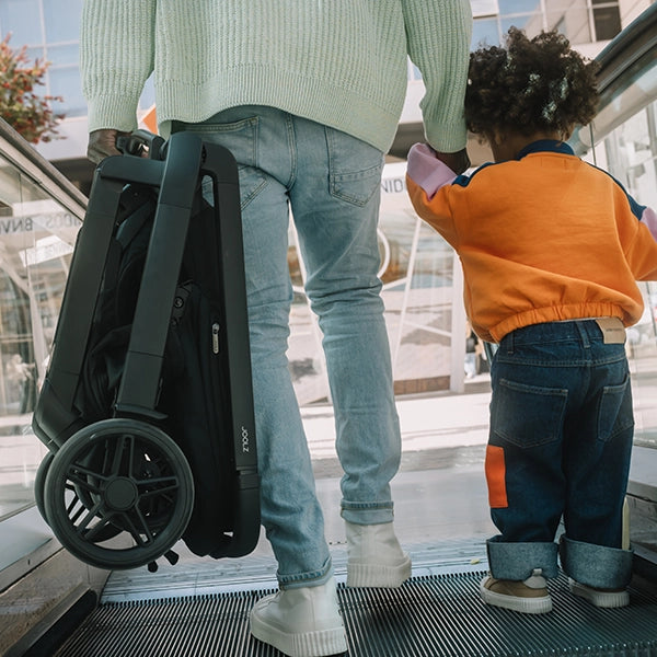 Joolz Hub² Compact Stroller Lifestyle Folded in Shopping Center