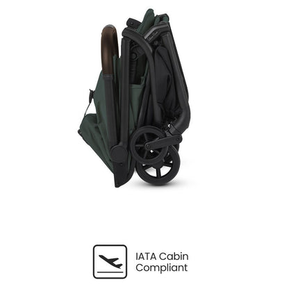 A side view of a compactly folded olive green stroller featuring an "IATA Cabin Compliant" icon.