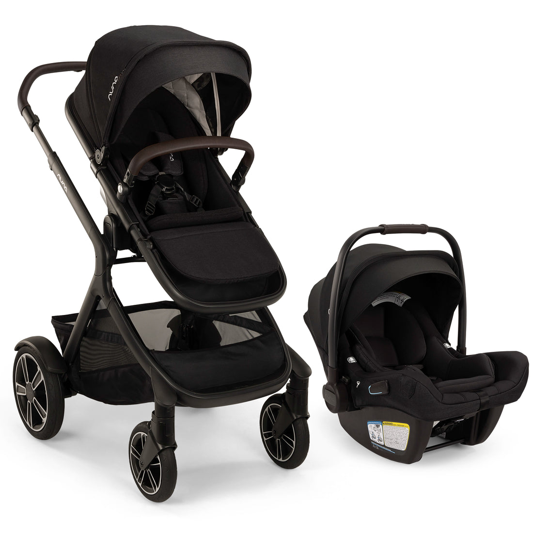 
A black Pujol stroller and matching infant car seat set, shown on a clean white background. The stroller features a black canopy, dark frame, and mesh side panels, while the car seat is positioned to the right.