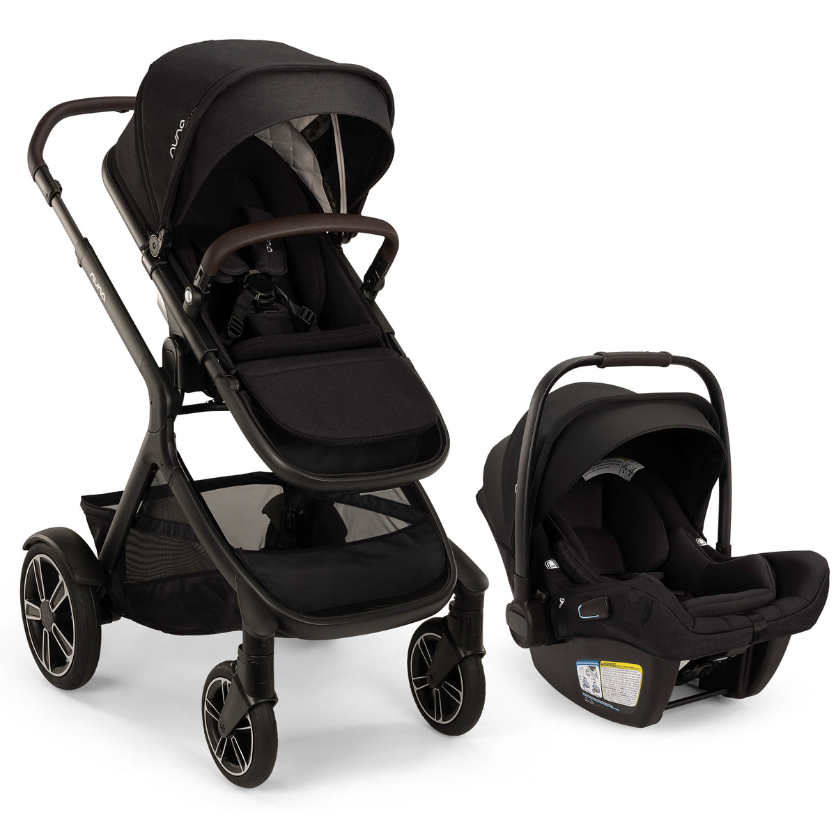 
A black Pujol stroller and matching infant car seat set, shown on a clean white background. The stroller features a black canopy, dark frame, and mesh side panels, while the car seat is positioned to the right.