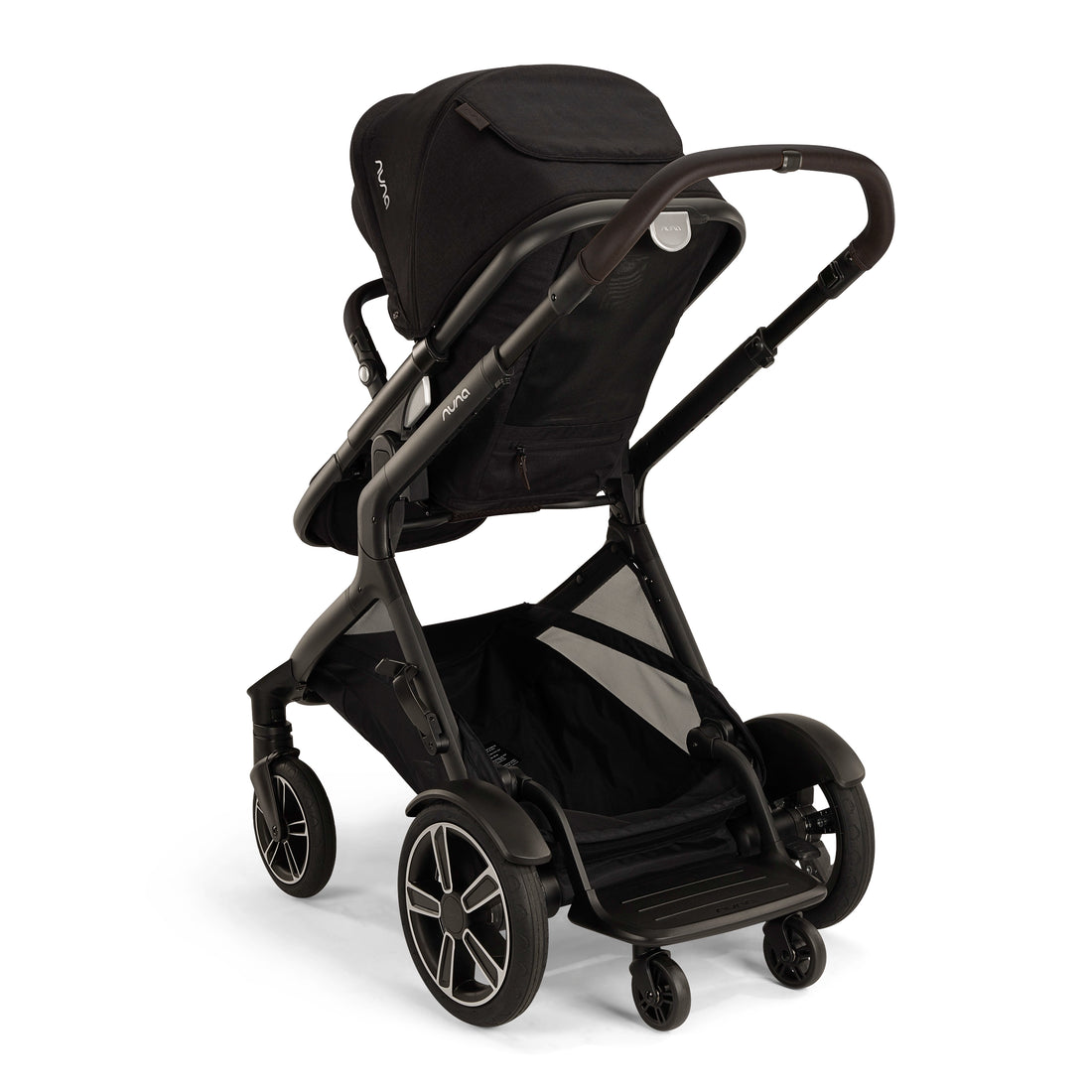 
Nuna Demi Next Stroller shown from a three quarter turn to show the Rider Board that's included with Demi Next for an older child to ride along their younger sibling.