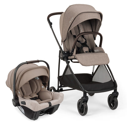 
A Pujol baby stroller and car seat travel system in taupe and black, shown on a clean white background with the stroller and matching infant car seat base displayed side by side.