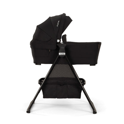 
Nuna Swiv & Triv series bassinet shown on stand that's stuiable for overnight sleep profile view of product image