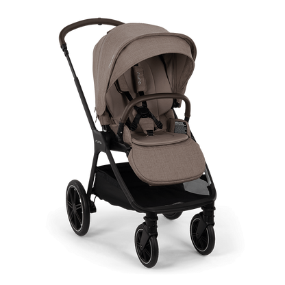 A modern stroller in a taupe-beige fabric with a black frame, shown from a three-quarter angle against a solid black background.