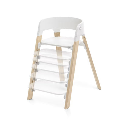 
A modern wooden step stool with a white molded plastic backrest and clear acrylic steps, shown on a clean white background.