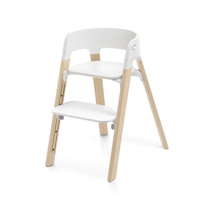 
A modern two-step wooden chair with a white molded plastic seat, backrest, and footrest, supported by four light natural wood legs, shown on a white background.
