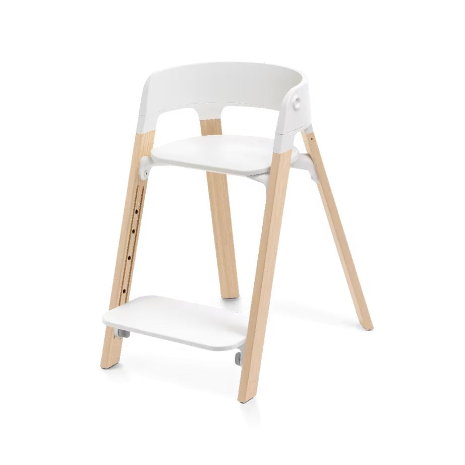 
A modern step stool chair with a white molded plastic seat, backrest, and footrest, supported by four natural light wood legs, shown on a clean white background.