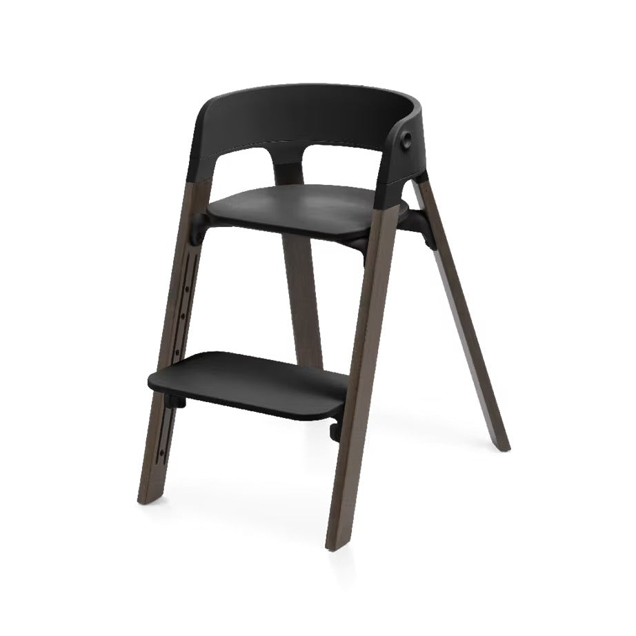 
A modern two-step wooden chair with a black molded plastic seat, backrest, and footrest, set against a plain white background.