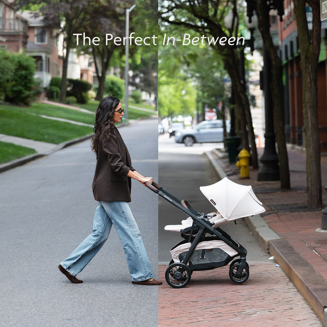 A woman walks along a tree-lined street pushing a double stroller. The image is split down the middle, with the left side showing her in a brown jacket and light blue jeans, and the right side showing the stroller alone on a brick sidewalk.