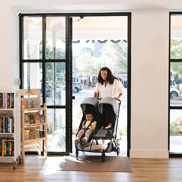 Uppababy Minu Duo in Greyson fitting through standard doorway Lifestyle