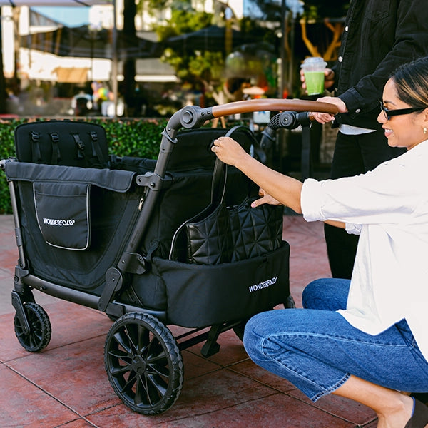 Wonderfold L4 Quad Stroller Wagon in Black Lifestyle Storage Bag
