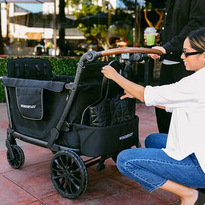 Wonderfold L4 Quad Stroller Wagon in Black Lifestyle Storage Bag