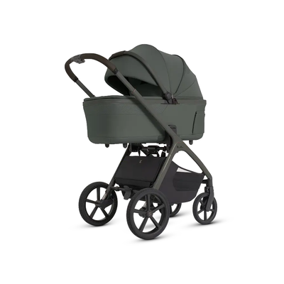 Studio view of the Silver Cross Cove 2 stroller equipped with the optional Cove 2 Compact Bassinet.
