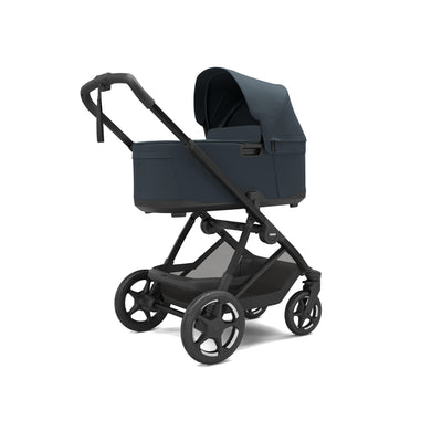 Dark blue Thule Charm with carrycot bassinet attached.
