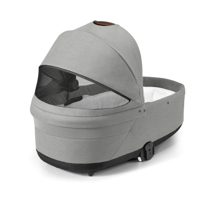 
Gray baby carrier with mesh window on a white background