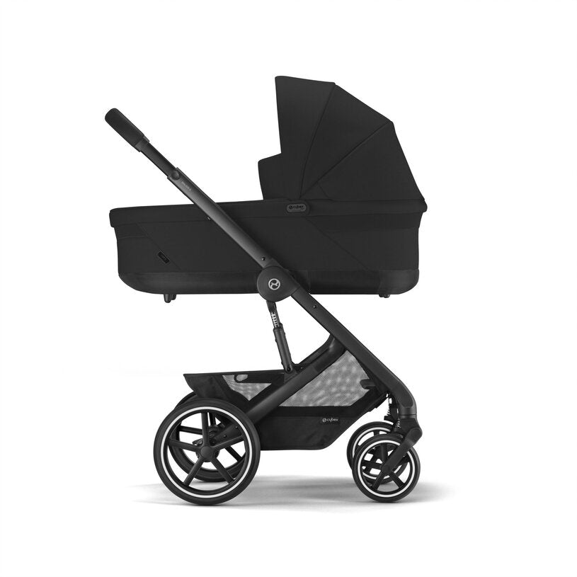 
Black baby stroller with canopy on a white background