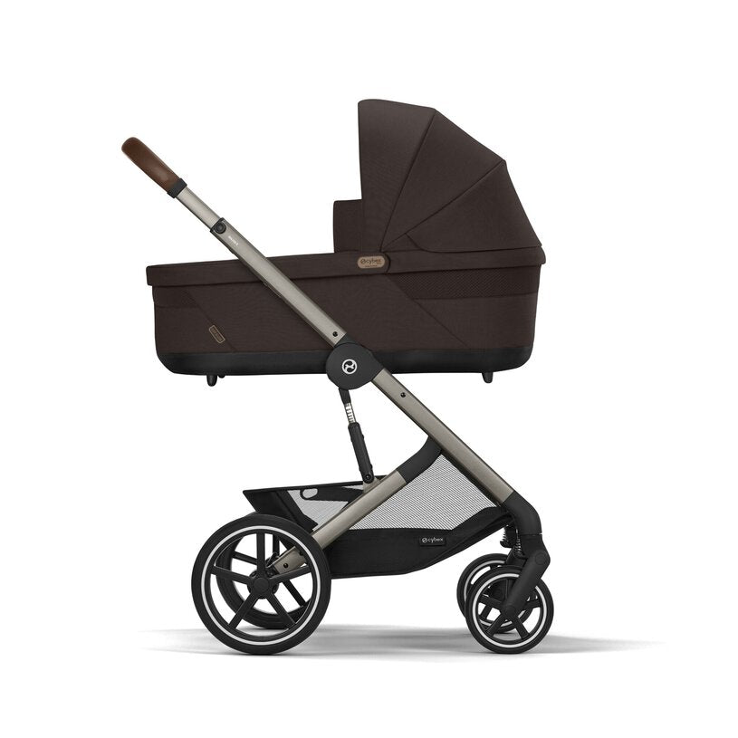 
Black and silver stroller on a white background