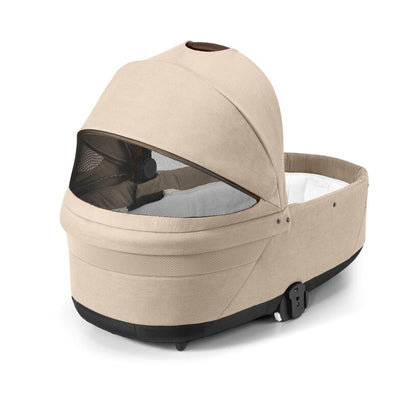 
Beige baby carrier with mesh window on a white background