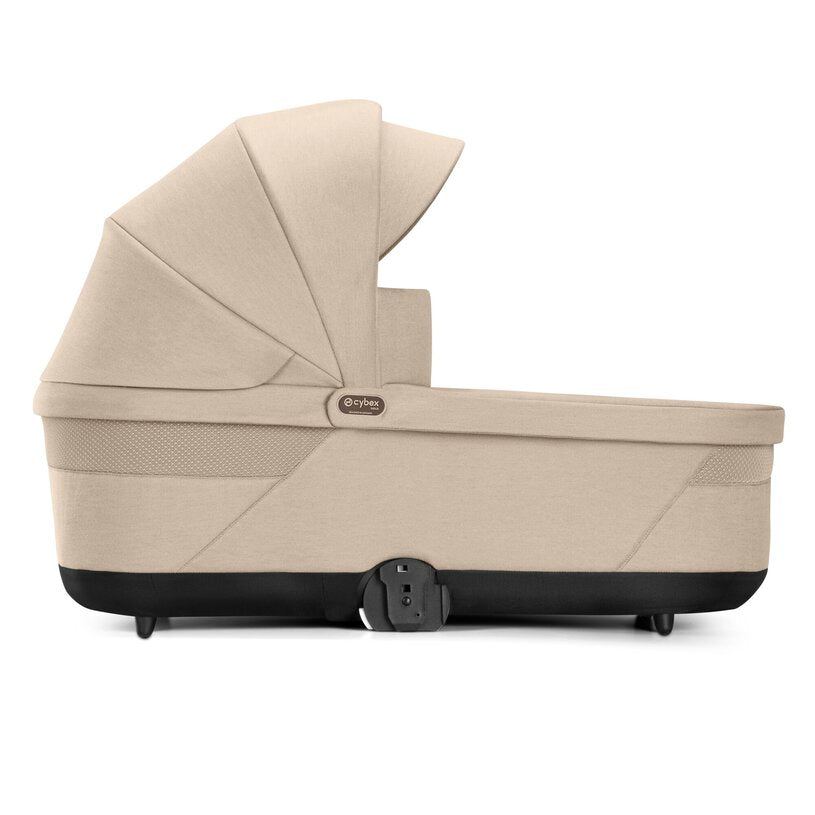 
Beige baby carrier with black accents on a white background