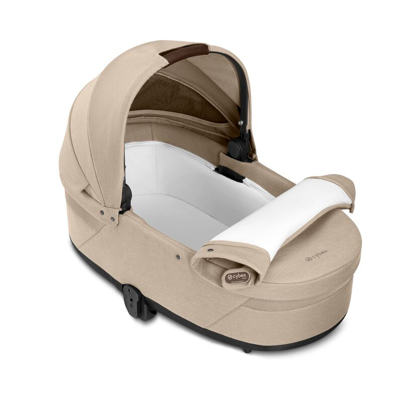 
Beige baby car seat with white interior on a white background