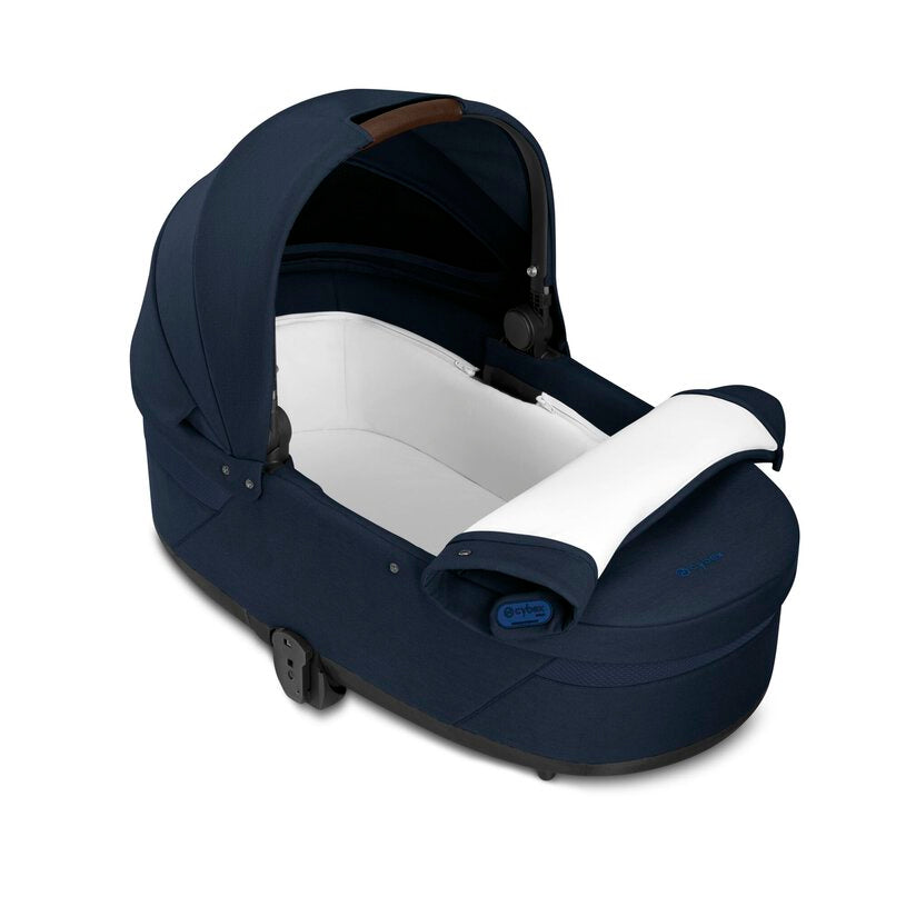 
Navy blue baby car seat with white interior on a white background