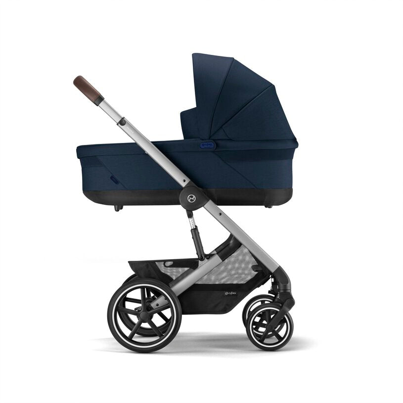 
Navy blue stroller with a black seat on a white background