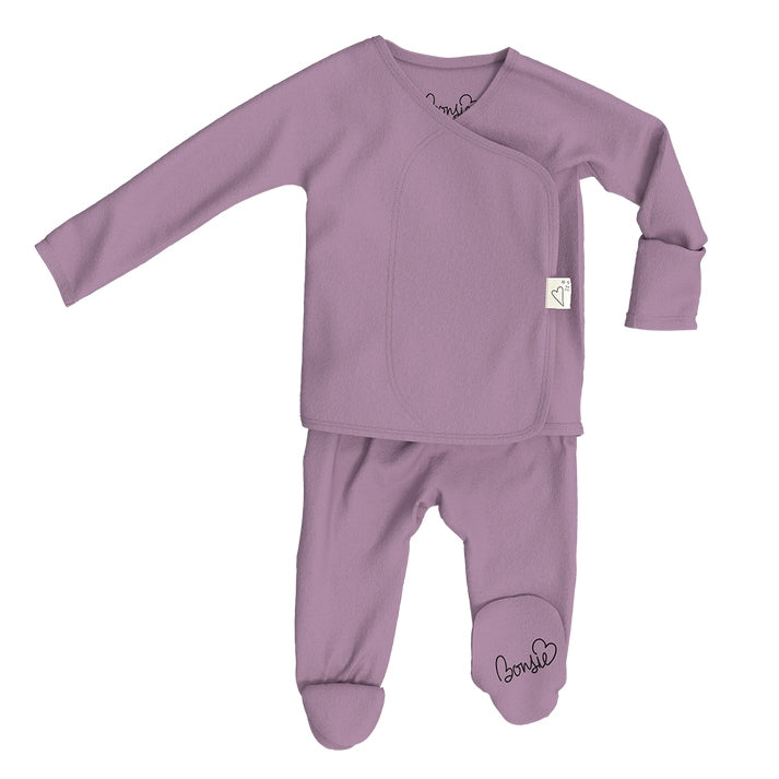 Purple baby outfit with long-sleeve top and footed pants on a white background