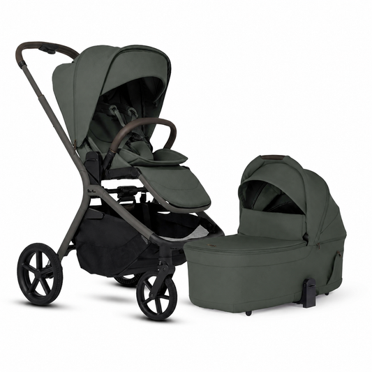 A stroller and bassinet travel system in a muted sage green color, shown on a clean white background. The stroller features a dark gray frame and black wheels, with a matching green footmuff and a separate bassinet placed beside it.