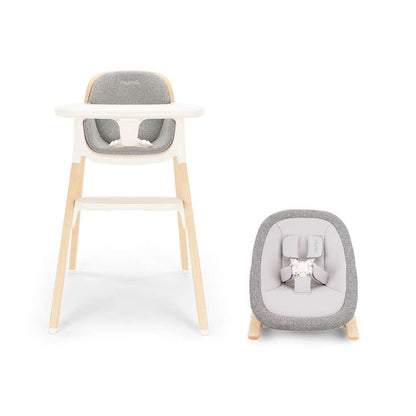 
High chair with a baby bouncer on a white background