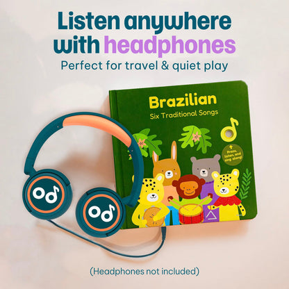
A children's hardcover book titled 'Brazilian Six Traditional Songs' with colorful animal illustrations on a green cover, shown next to teal and orange over-ear headphones. Large text at the top reads 'Listen anywhere with headphones' and smaller text says 'Perfect for travel & quiet play.