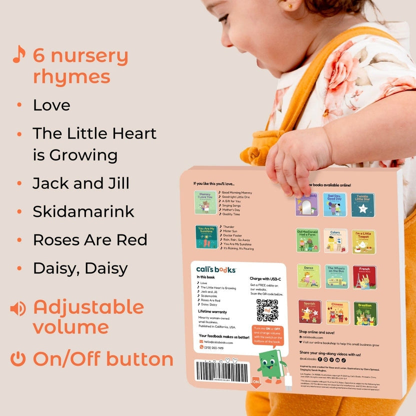 
Baby holding a book with nursery rhyme text and a QR code on the cover