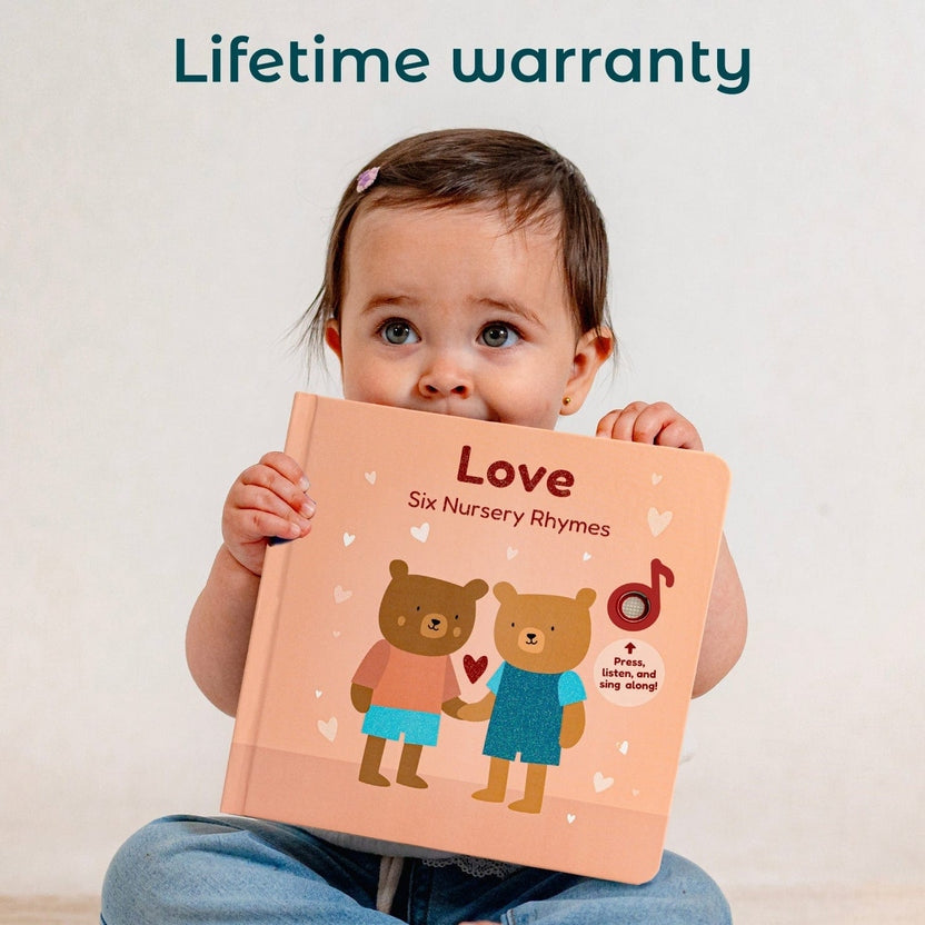 
Child holding a book titled 'Love Six Nursery Rhymes' with a 'Lifetime warranty' text above.