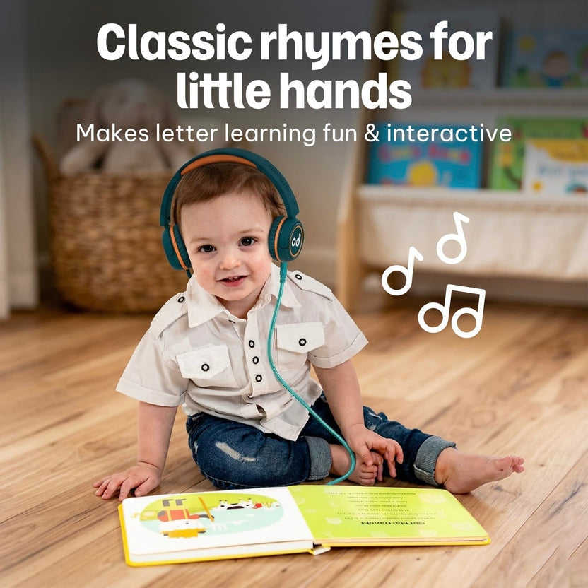
A toddler wearing headphones sits on the floor with an open nursery rhyme book.