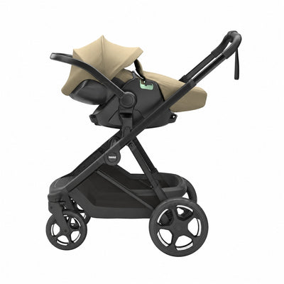 Thule Charm 2-in-1 stroller frame in khaki with infant car seat attached.
